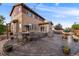 The backyard features a patio, hot tub, outdoor kitchen, and dining area at 14384 Big Stone Dr, Parker, CO 80134