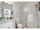 Modern bathroom with granite countertops, a glass-enclosed shower, and white subway tile at 14384 Big Stone Dr, Parker, CO 80134