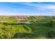 Expansive community park with lush green spaces and a charming shaded picnic area at 14384 Big Stone Dr, Parker, CO 80134