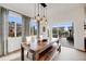 Elegant dining room with a wooden table, comfortable seating, and bright windows that offer plenty of natural light at 14384 Big Stone Dr, Parker, CO 80134