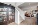 Inviting entryway showcasing a beautiful staircase, hardwood floors, and a display cabinet, leading into a cozy living space at 14384 Big Stone Dr, Parker, CO 80134