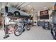 Organized garage with car lift, classic car, and workbench for car enthusiasts at 14384 Big Stone Dr, Parker, CO 80134