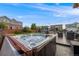 Backyard with manicured lawn, hot tub, fire pit, and outdoor kitchen at 14384 Big Stone Dr, Parker, CO 80134