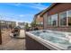 Backyard with hot tub, outdoor kitchen, patio and low-voltage lighting at 14384 Big Stone Dr, Parker, CO 80134