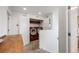 Well-lit laundry room features side-by-side washer and dryer, and shelving for storage at 14384 Big Stone Dr, Parker, CO 80134