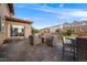 The cozy patio has plentiful seating, a fire pit, and outdoor grill and dining set at 14384 Big Stone Dr, Parker, CO 80134