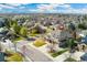 Elevated view displaying the home and surrounding neighborhood, with mountain views in the distance at 5289 W Euclid Pl, Littleton, CO 80123