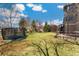 Well-maintained backyard with a trampoline and a charming wooden fence at 5289 W Euclid Pl, Littleton, CO 80123