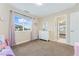 This well-lit bedroom features a cozy bed, dresser, and a large window at 5289 W Euclid Pl, Littleton, CO 80123