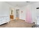 The bedroom features a vanity, a cozy bed, and an ensuite bathroom at 5289 W Euclid Pl, Littleton, CO 80123