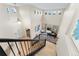 Bright, two-story foyer with hardwood floors, grand piano, and ample natural light at 5289 W Euclid Pl, Littleton, CO 80123