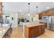 Open kitchen featuring granite countertops, stainless steel appliances, and a view into the living room at 5289 W Euclid Pl, Littleton, CO 80123