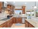 Well-equipped kitchen with granite countertops, stainless steel appliances, and ample cabinet space overlooking the backyard at 5289 W Euclid Pl, Littleton, CO 80123