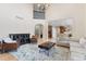 Spacious living room with high ceilings, fireplace, and open floor plan to kitchen at 5289 W Euclid Pl, Littleton, CO 80123