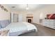 Comfortable main bedroom with fireplace, ensuite bathroom, and neutral decor at 5289 W Euclid Pl, Littleton, CO 80123