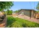 Spacious backyard with a well-kept lawn, a patio, and a privacy fence, perfect for outdoor enjoyment at 621 S Harrison Ln, Denver, CO 80209