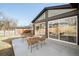 Stylish backyard patio with modern furniture, creates an inviting outdoor space for relaxation and entertainment at 621 S Harrison Ln, Denver, CO 80209