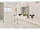 Bathroom featuring double sinks and a vanity with black hardware at 621 S Harrison Ln, Denver, CO 80209