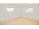 Brightly lit room featuring neutral decor and hardwood floors at 621 S Harrison Ln, Denver, CO 80209