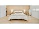 Bright bedroom features a wood accent wall, plush bedding, and modern design elements at 621 S Harrison Ln, Denver, CO 80209