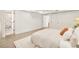 Bedroom with light colored walls, rug, and neutral-toned bedding at 621 S Harrison Ln, Denver, CO 80209
