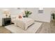 Cozy bedroom showcases a plush bed, decorative lamps, and a stylish area rug creating a relaxing retreat at 621 S Harrison Ln, Denver, CO 80209