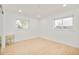 Brightly lit room features neutral decor and hardwood floors at 621 S Harrison Ln, Denver, CO 80209
