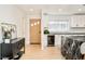 Bright modern kitchen features a marble waterfall island, white cabinets, and stainless steel appliances at 621 S Harrison Ln, Denver, CO 80209