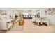Bright, modern living room seamlessly flows into the dining area and kitchen with lots of natural light at 621 S Harrison Ln, Denver, CO 80209