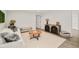 Cozy living room featuring stylish furniture, decor, and a modern color palette at 621 S Harrison Ln, Denver, CO 80209