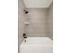 Modern shower featuring gray tile and black plumbing fixtures at 621 S Harrison Ln, Denver, CO 80209