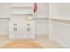 Walk-in closet with custom storage solutions, including cabinets, shelves and hanging rods at 621 S Harrison Ln, Denver, CO 80209