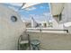 Cozy balcony with seating, perfect for relaxing outdoors and enjoying the views at 1820 Newland Ct # 313, Lakewood, CO 80214