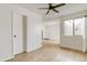 Bright living room with wood-look flooring, a ceiling fan, and a window with natural light at 1820 Newland Ct # 313, Lakewood, CO 80214