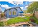 Beautiful backyard features a well-maintained lawn, patio, garden, and pond at 12133 Crabapple St, Broomfield, CO 80020