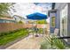 Backyard patio with an umbrella, surrounded by greenery, offering a private outdoor space at 12133 Crabapple St, Broomfield, CO 80020