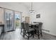Dining room with modern chandelier, gray chairs, and sliding door to the outdoor space at 12133 Crabapple St, Broomfield, CO 80020