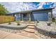 Charming home with stone pathway leading to front porch, and xeriscaped landscaping at 12133 Crabapple St, Broomfield, CO 80020