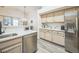 Well-lit kitchen featuring stainless steel appliances and bright countertops at 12133 Crabapple St, Broomfield, CO 80020