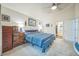 Spacious main bedroom features neutral carpet, a ceiling fan, and ensuite bathroom at 12133 Crabapple St, Broomfield, CO 80020
