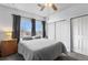 Bedroom with neutral tones, a ceiling fan, and a window providing natural light at 3857 Mossy Rock Dr # 201, Highlands Ranch, CO 80126