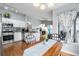 Eat-in kitchen with stainless steel appliances, adjacent to cozy dining area with natural light at 3857 Mossy Rock Dr # 201, Highlands Ranch, CO 80126