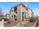 Charming multi-level condo featuring a private balcony and well-maintained landscaping at 3857 Mossy Rock Dr # 201, Highlands Ranch, CO 80126