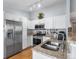 Bright kitchen boasts granite counters, stainless steel appliances, and ample cabinet space at 3857 Mossy Rock Dr # 201, Highlands Ranch, CO 80126