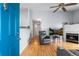 Inviting living room featuring hardwood floors, a cozy fireplace, and an abundance of natural light at 3857 Mossy Rock Dr # 201, Highlands Ranch, CO 80126