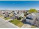 Wide aerial view of a neighborhood showcasing the home's placement among other residences and streets at 3788 Chavez St, Brighton, CO 80601