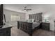 Primary bedroom features a statement headboard, ceiling fan, and lots of natural light at 3788 Chavez St, Brighton, CO 80601