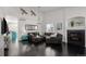 Comfortable living room with dark floors, a fireplace, and tasteful decor creating a welcoming atmosphere at 3788 Chavez St, Brighton, CO 80601