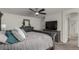 This main bedroom has a ceiling fan, TV, and attached bathroom with stand-alone glass shower at 3788 Chavez St, Brighton, CO 80601