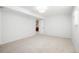 Large basement room with neutral carpet, white walls and access to other rooms at 1205 W 101St Ave, Northglenn, CO 80260